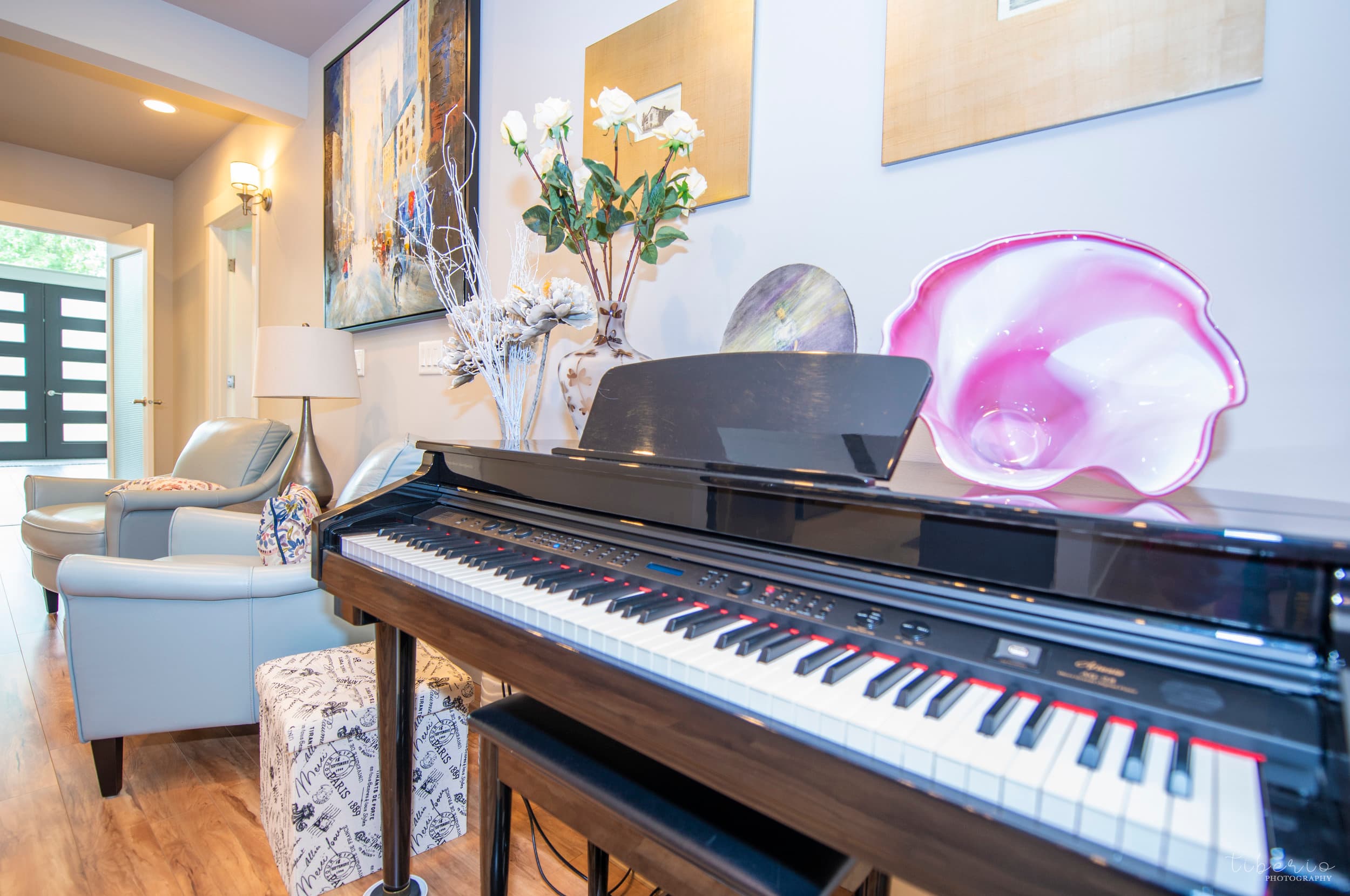 Piano and artwork in a Kenmore Retreat common area