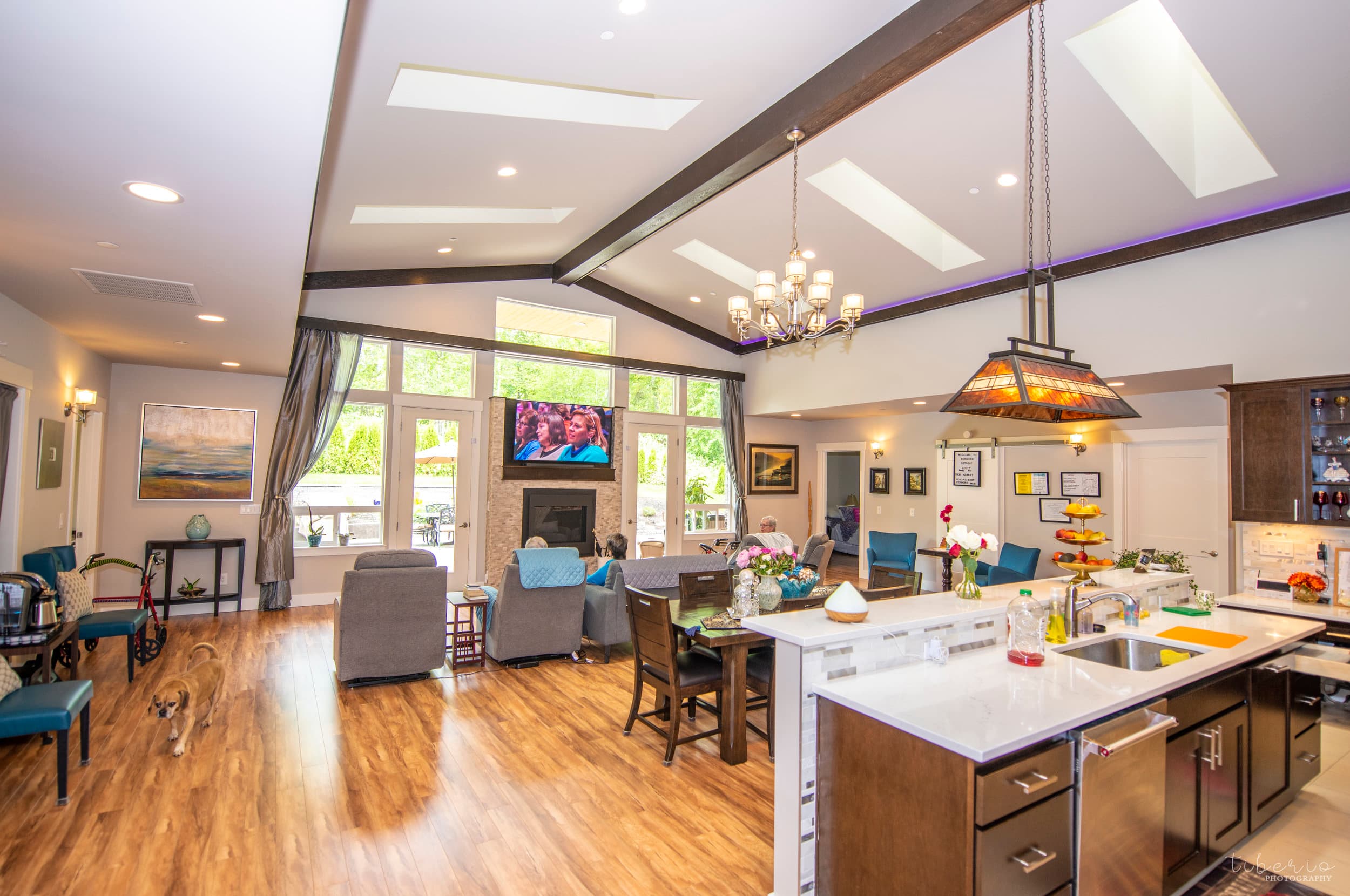 Open living, dining, and kitchen space inside Kenmore Retreat